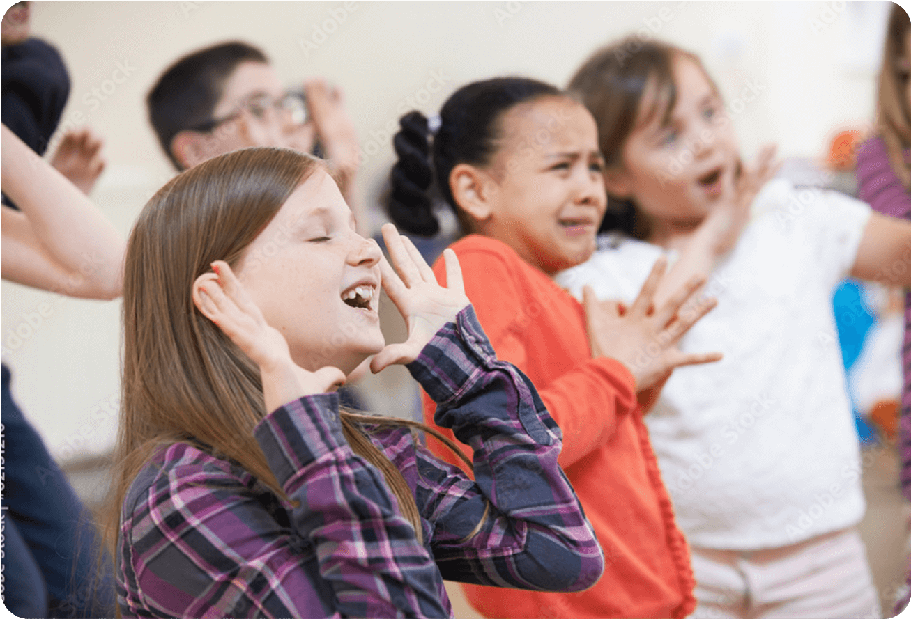 Kids performing in a theatre class.